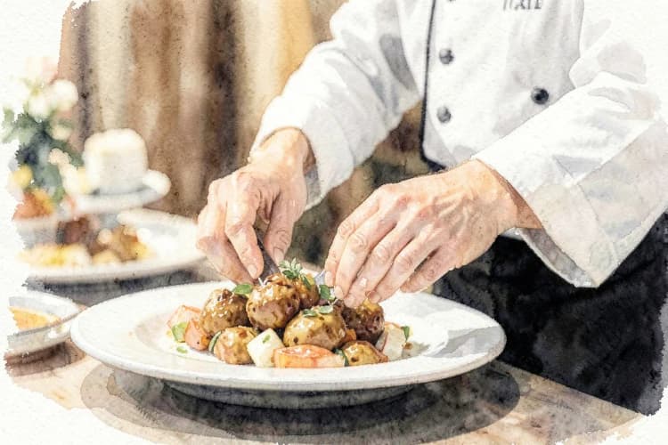 Chef servindo comida em um buffet de casamento.